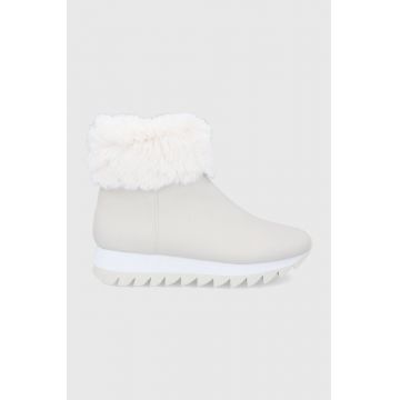 Dkny Botine femei, culoarea crem, cu toc plat, izolat Dkny Botine femei, culoarea crem, cu toc plat, izolat